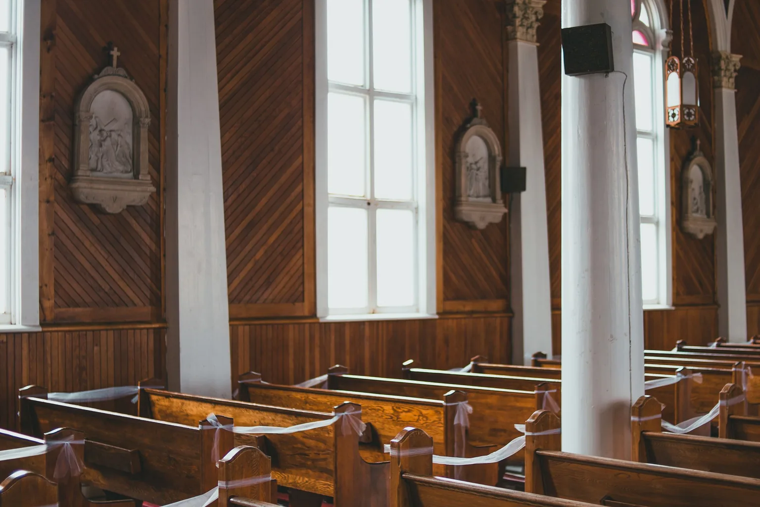 Rows of pews inside a church interior