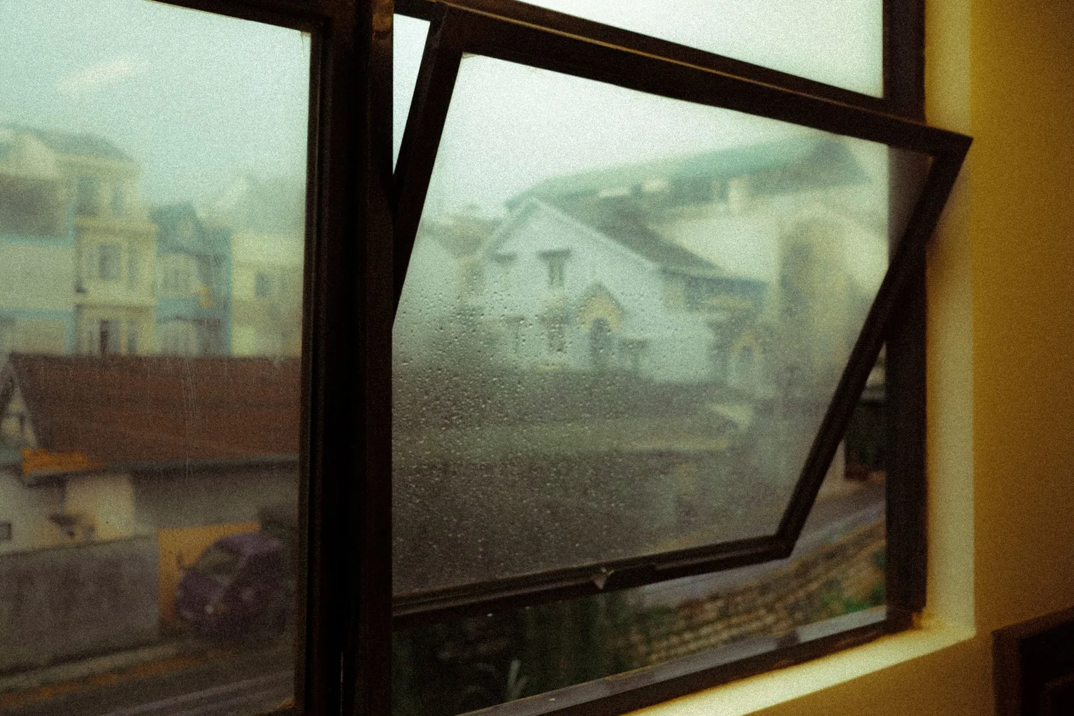A black wooden framed glass window