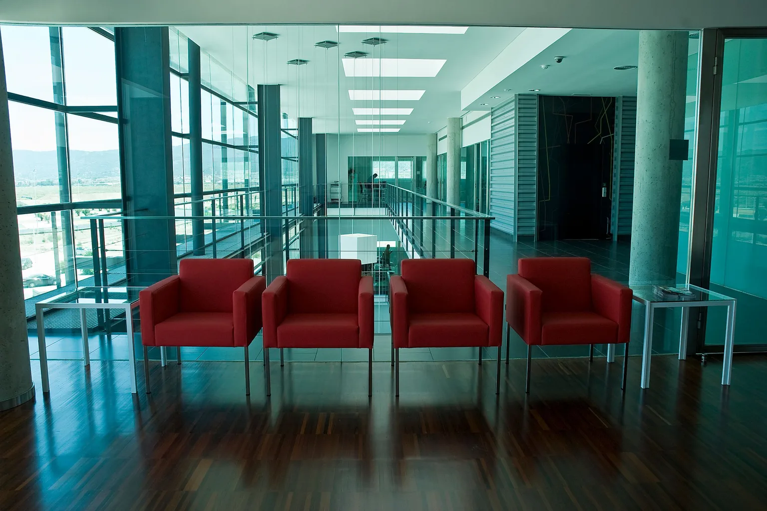 Red chairs in a modern office lobby